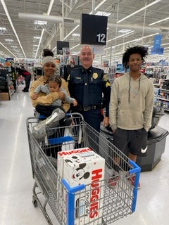 image of a cop posing with a family